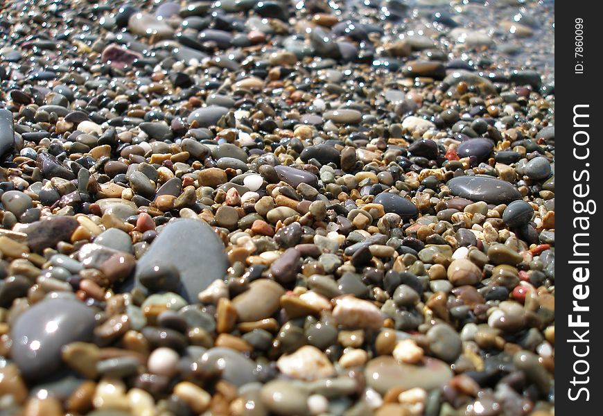 The beach is strewn with shingle. The beach is strewn with shingle