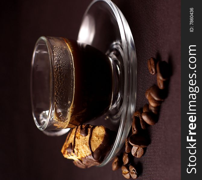 Transparent cup of coffee,cantuccini and coffee beans. Transparent cup of coffee,cantuccini and coffee beans