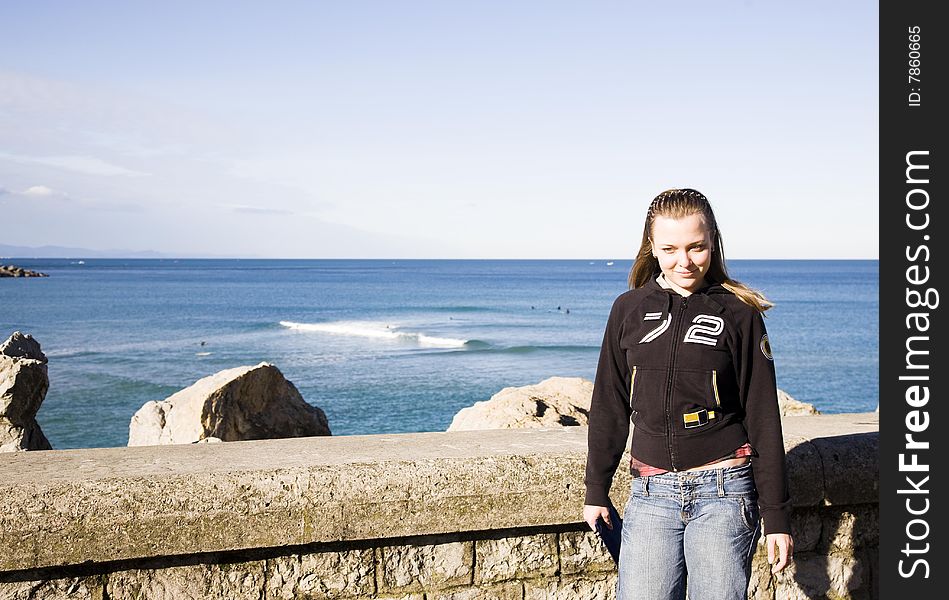 Young Woman Portrait On The Ocean Background