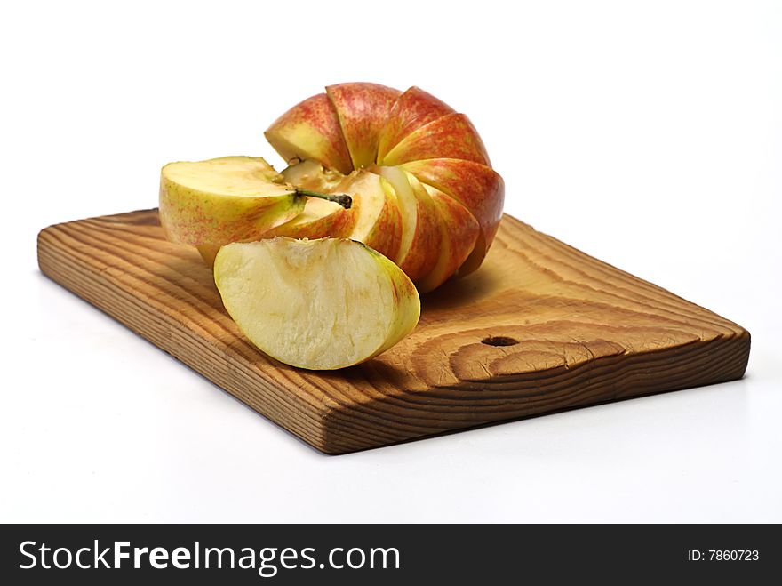 Section apple on wooden plate. Section apple on wooden plate