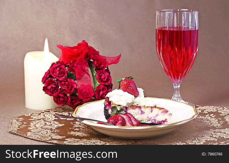 Elegant Strawberry Cheesecake on plate with glass red cream soda and candle with copy space