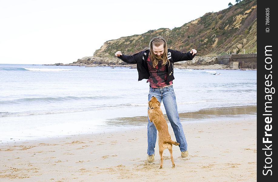 Woman With Dog On The Beach