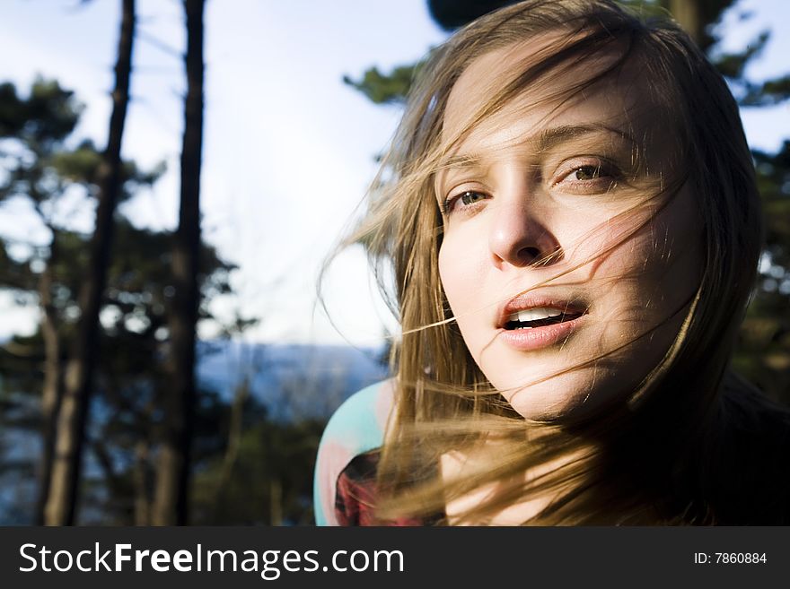 Pretty Woman Portrait On The Nature Background. Focus On The Lips