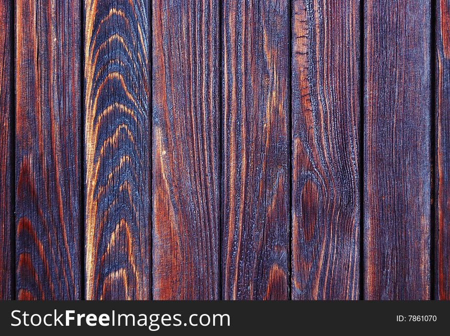 Rough burnt wooden paneling texture. Rough burnt wooden paneling texture