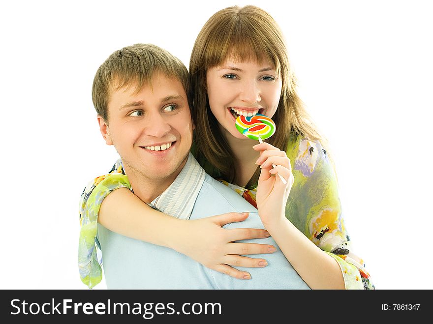 Happy couple, young man giving his girlfriend piggyback ride