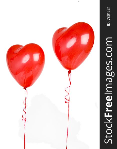 Two latex heart balloons isolated on white