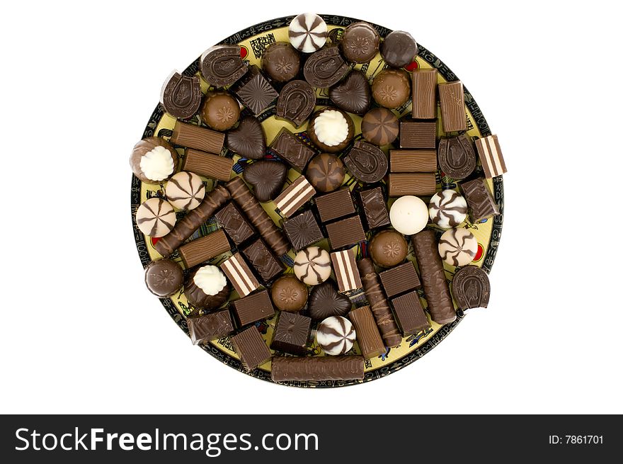 Chocolate sweets on dish , isolated