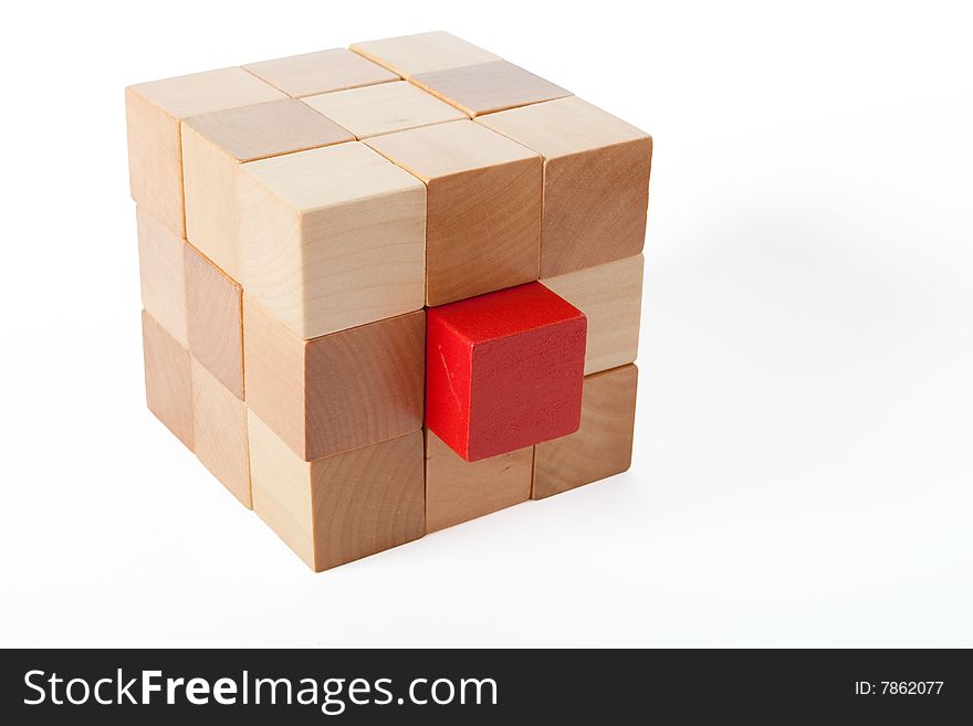 One red in a brick of brown cubes. One red in a brick of brown cubes