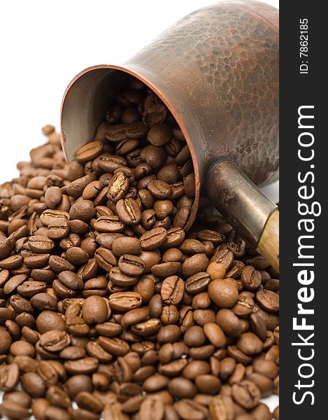 Closeup image of brown coffee in a turkish coffeemaker