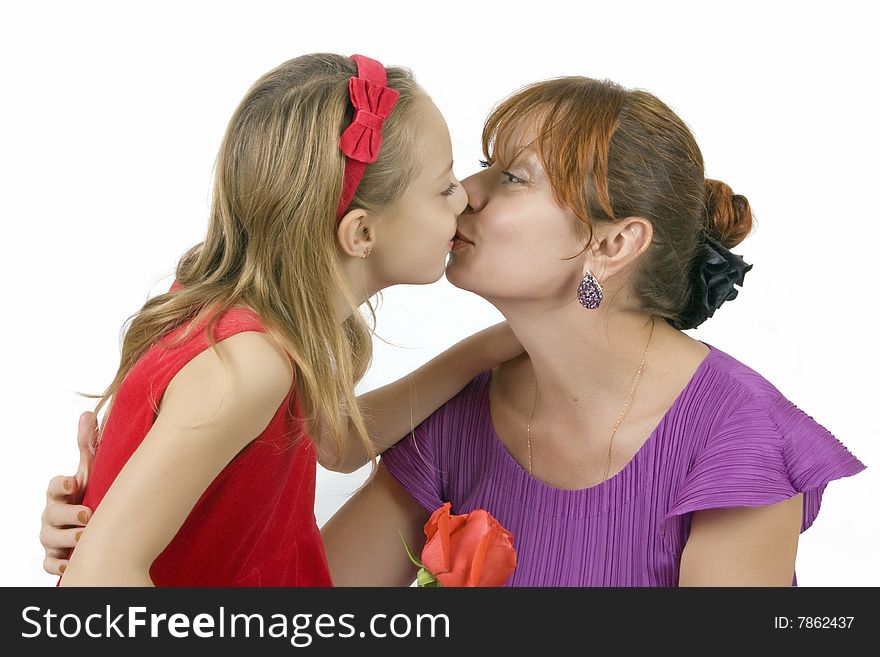 Embraces happy mothers with the little daughter over white background