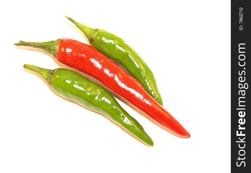 Green Finger Chillies and Bird Eye Chillies on a white background. Green Finger Chillies and Bird Eye Chillies on a white background