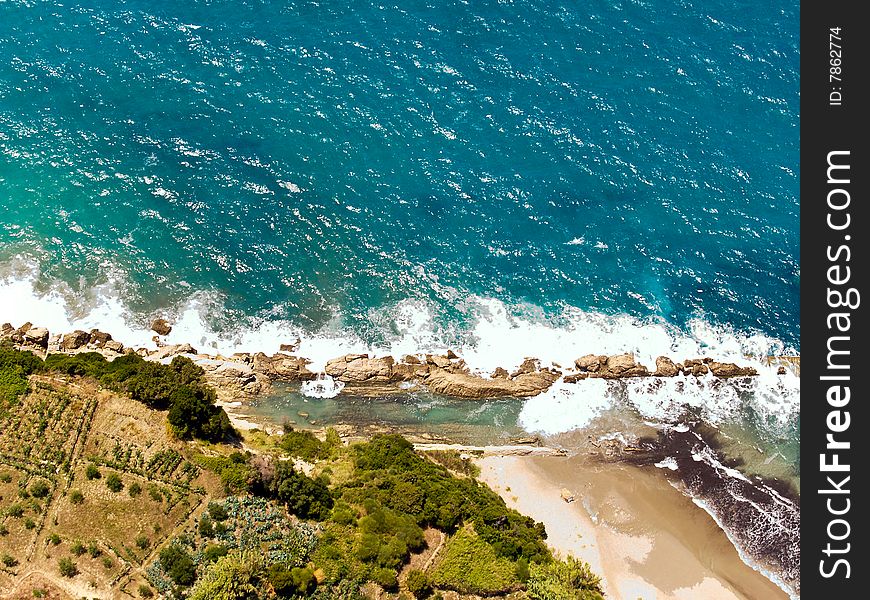 Waves splashing at the shore, aerial view. Waves splashing at the shore, aerial view