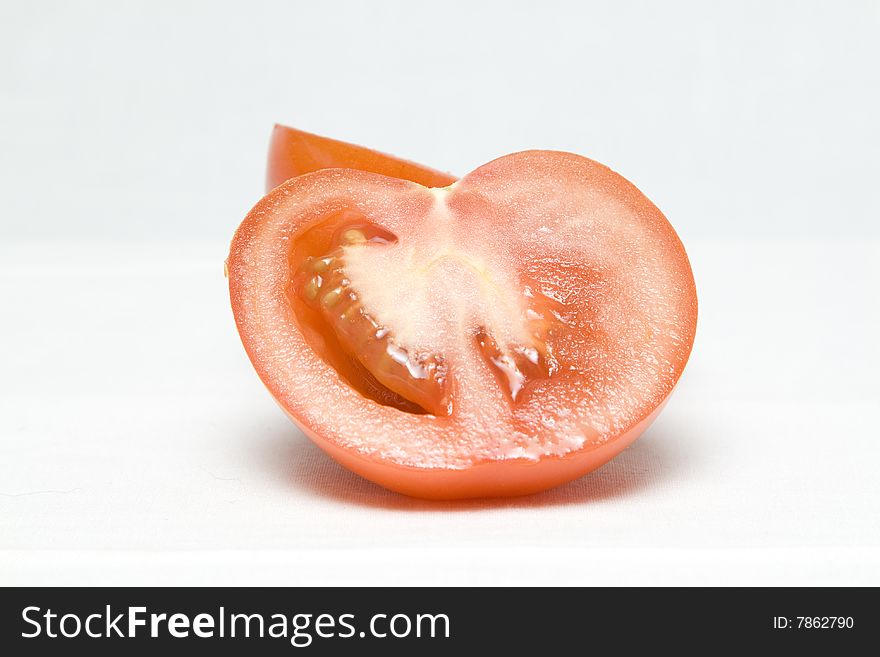 The tomato cut in the middle on two halves