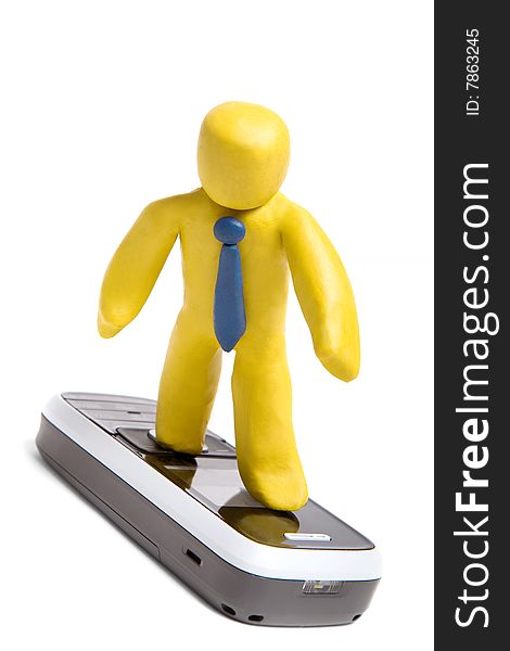 Plasticine man standing on mobile phone like surfer isolated on white