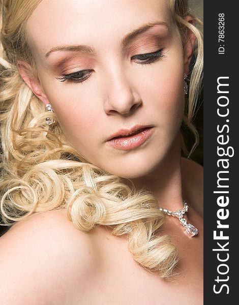 Beautiful Blond bride wearing diamond jewelery