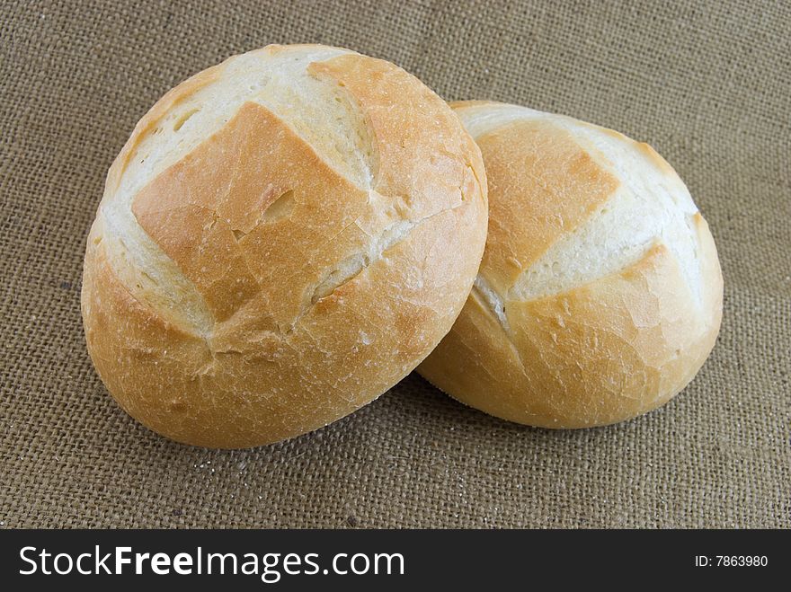 Two boules set upon burlap