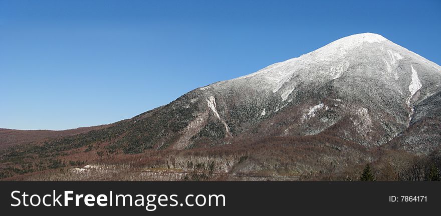A snow covered mountain panorama scene. A snow covered mountain panorama scene
