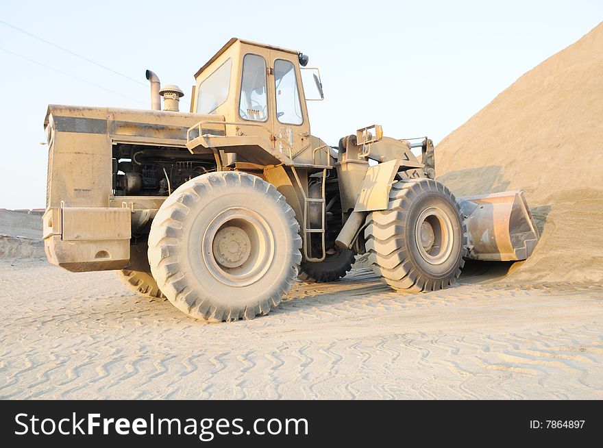 The Bulldozer In The Sand Pit