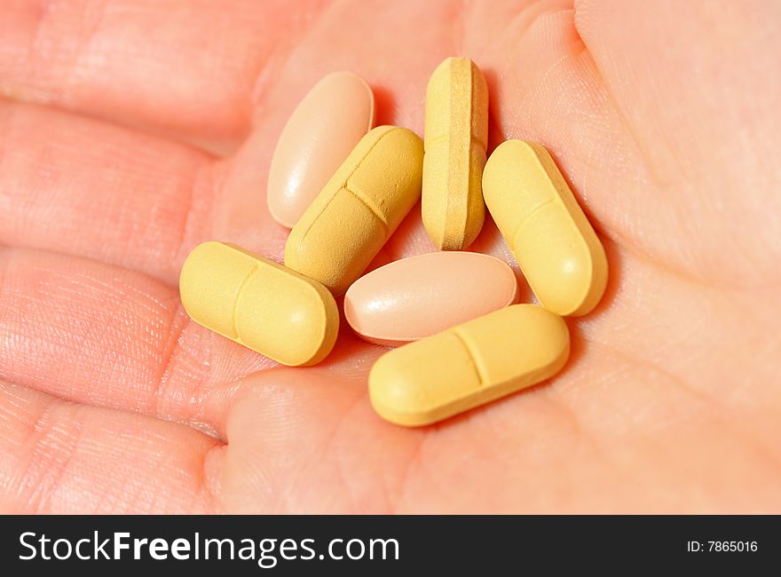 Hand holding diverse pills (closeup). Hand holding diverse pills (closeup)