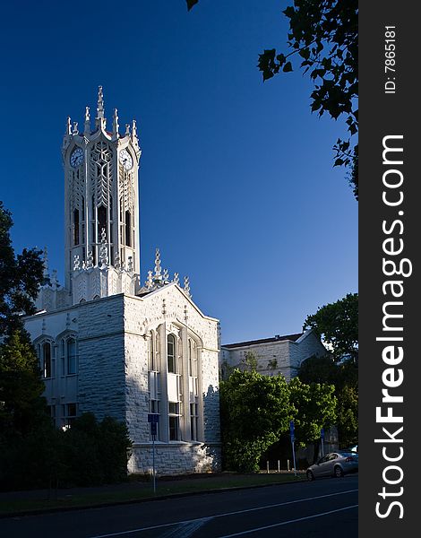 A white detailed church under blue sky