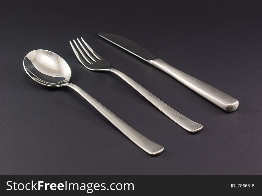 Cutlery Inox, Fork, knife, spoon on black background