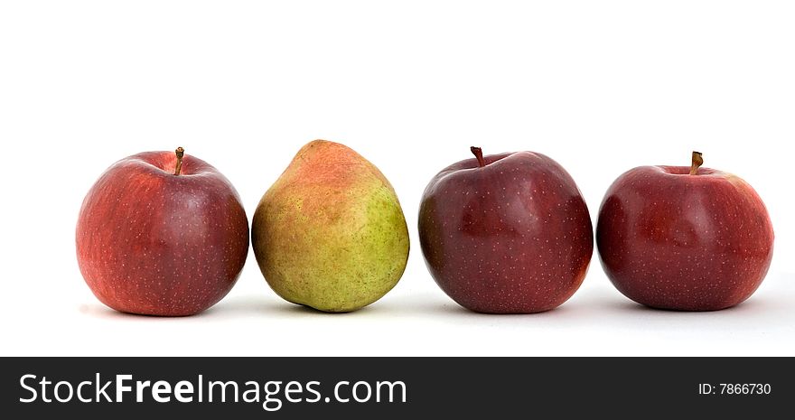 Three apples and pear isolated on white background