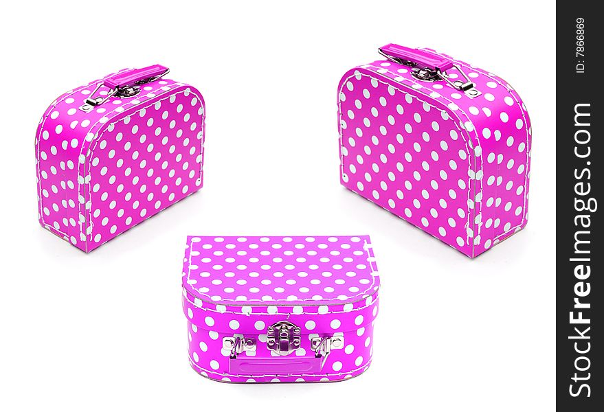 Shot of three colourful spotty cases on white