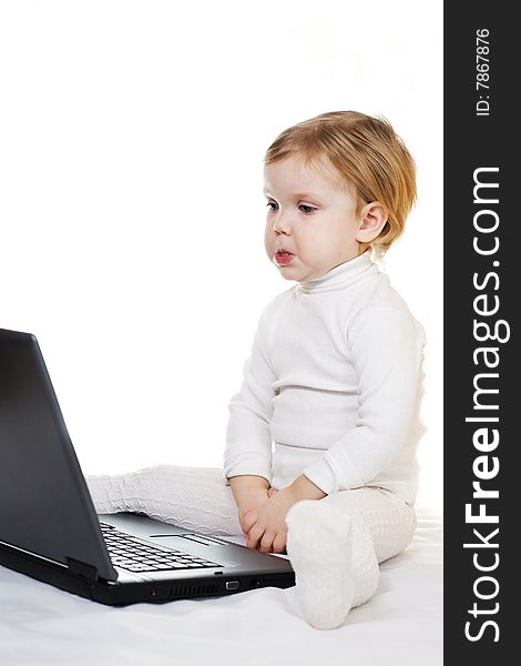 Stock photo: an image of a little girl  with laptop. Stock photo: an image of a little girl  with laptop