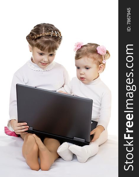 Stock photo: an image of two nice girls with laptop. Stock photo: an image of two nice girls with laptop