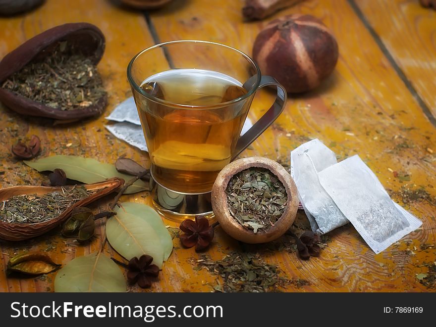 Cup of peppermint tea with diverse herbs