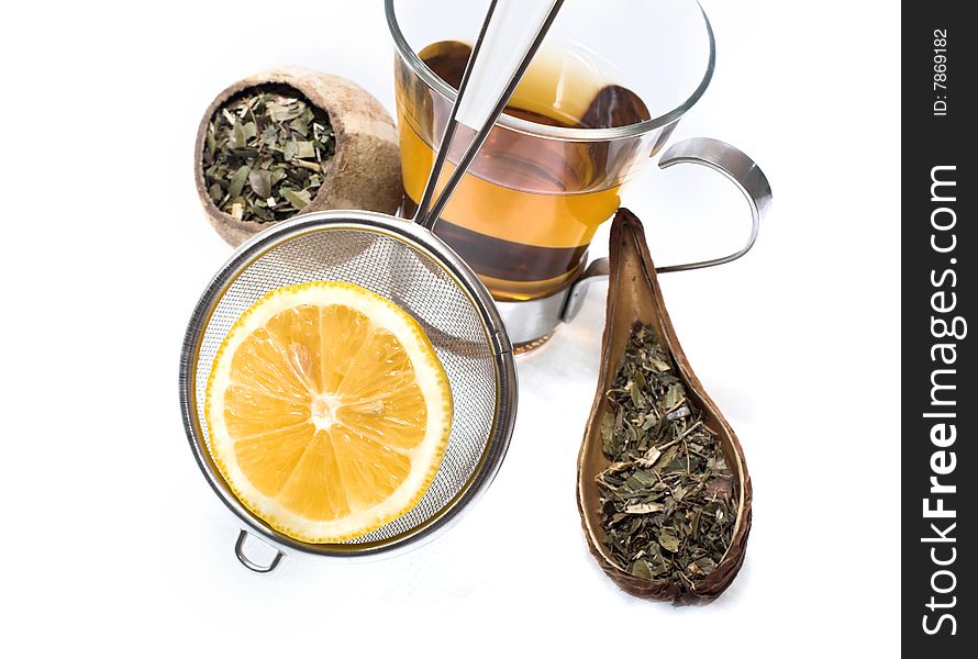 Cup of peppermint tea with lemon and herbs