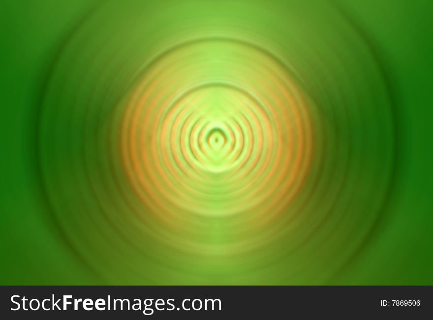 Green circle abstraction with orange and yellow in the middle