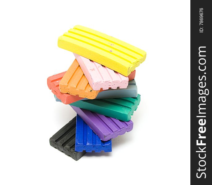 Colorful plasticine bricks on white