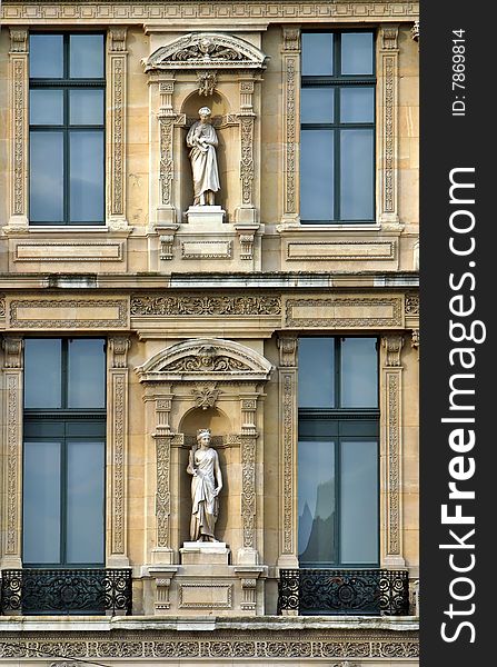 Sculptures in the niches of the building in Paris, France