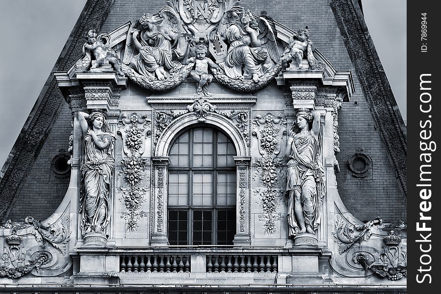 Sculptures on the facade of the building in Paris, France