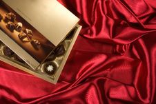 Chocolates Box On Red Satin Stock Photo Chocolates Box On Red Satin Stock Photo