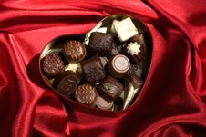 Heart Shaped Box Of Candy On Red Satin Background Stock Image Heart Shaped Box Of Candy On Red Satin Background Stock Image