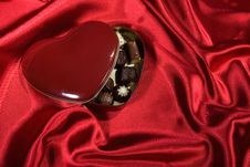 Heart Shaped Box Of Candy On Red Satin Background Royalty Free Stock Photos Heart Shaped Box Of Candy On Red Satin Background Royalty Free Stock Photos