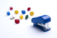 Blue Stapler On White With Thumb Tacks. Royalty Free Stock Photography