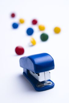 Blue Stapler On White With Thumb Tacks. Stock Images