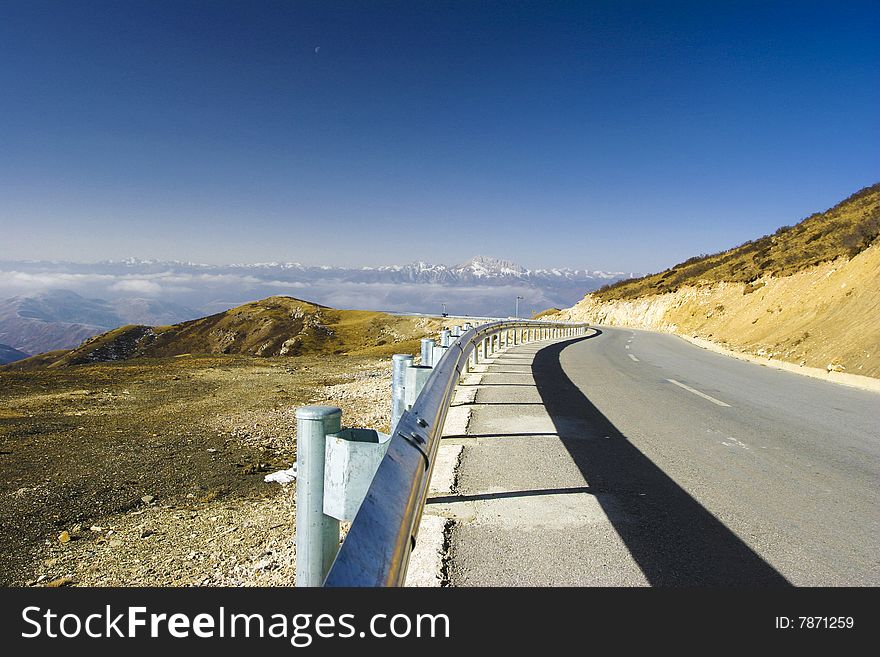 The highway of high mountain imitates a Buddha to lead to heaven. The highway of high mountain imitates a Buddha to lead to heaven