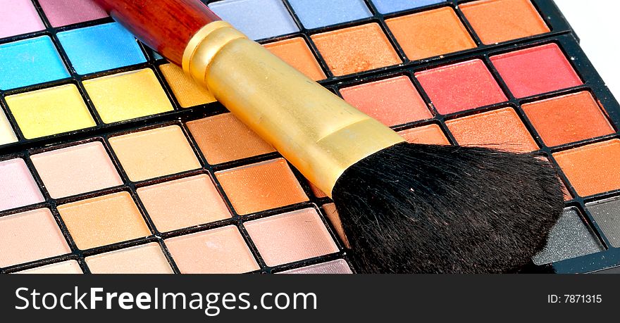 Closeup of makeup brush and shades.