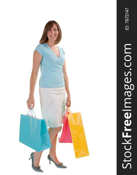 Attractive woman carrying a handful of shopping bags. Attractive woman carrying a handful of shopping bags
