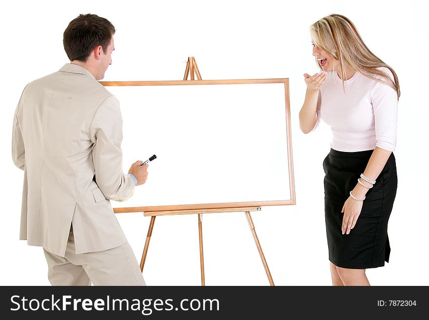 Two business people standing at a whiteboard