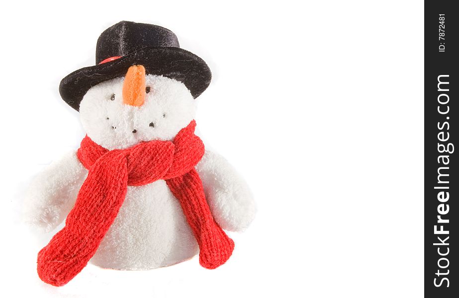 Stuffed snowman with a red scarf and black hat