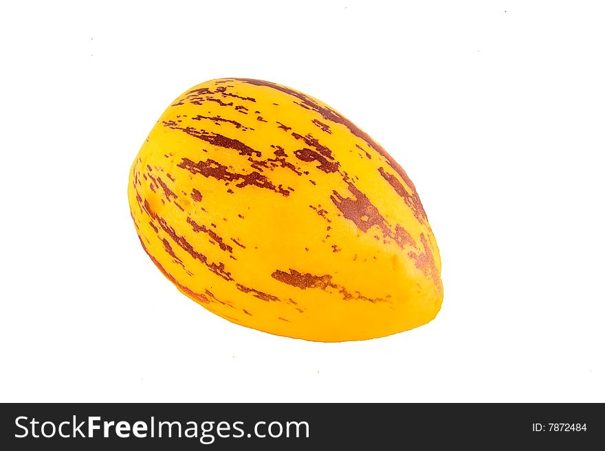 A brightly colored exotic melon isolated on white. A brightly colored exotic melon isolated on white