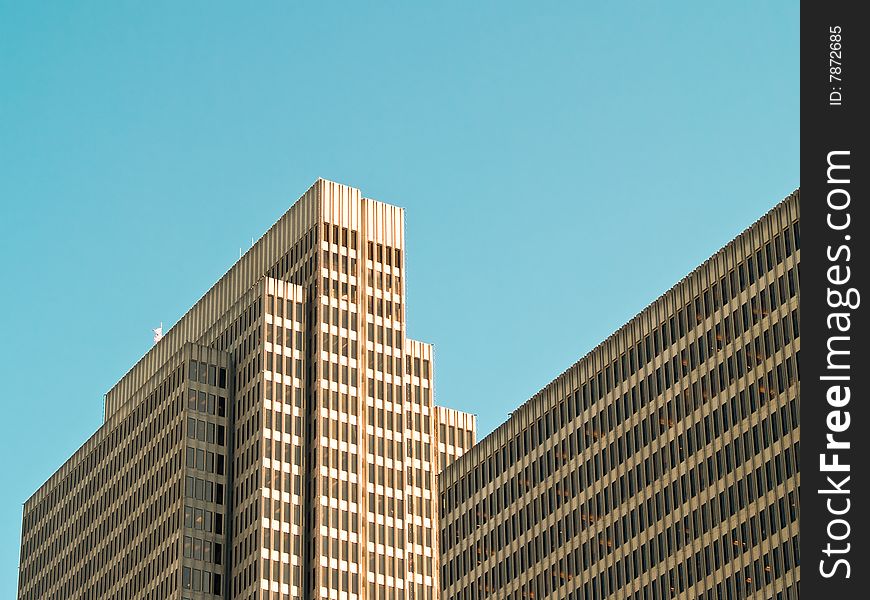 Modern Office Building against bright blue sky.
