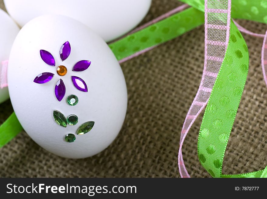 Bejeweled easter egg with brightly colored ribbons. Bejeweled easter egg with brightly colored ribbons