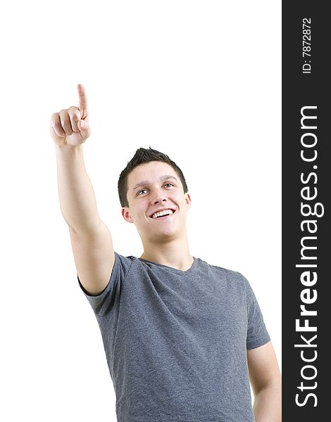 Handsome young man isolated on a white background and pointing to copy space