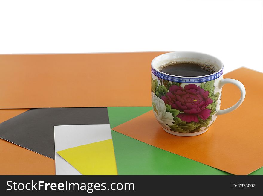 Cup with the coffee against the combined background. Cup with the coffee against the combined background